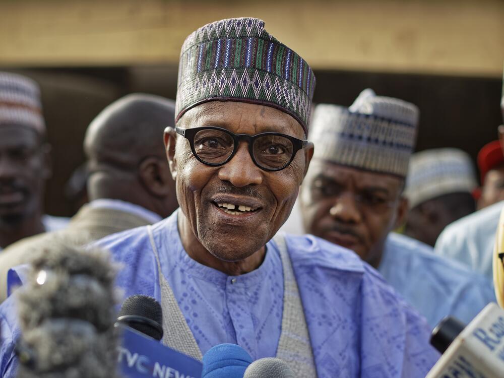 Nigeria's President Muhammadu Buhari speaks to the media after casting his vote in his hometown of Daura, in northern Nigeria, Saturday, Feb. 23, 2019. (AP Photo/Ben Curtis, File)