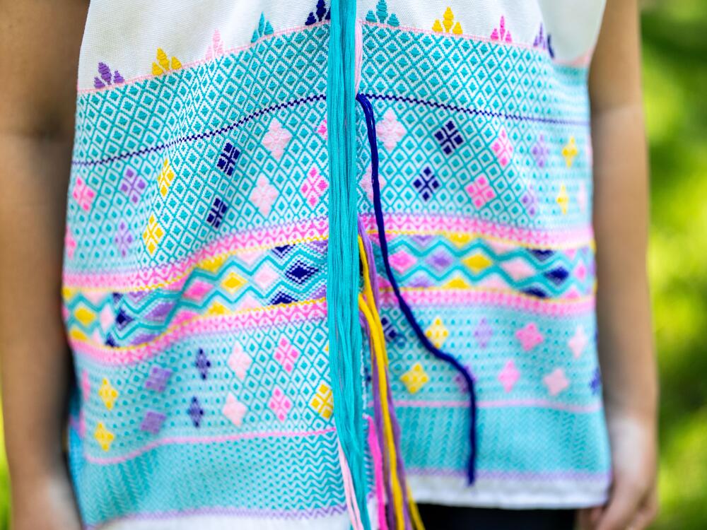 A detail of Ku Say's blouse. It took her three days to weave the garment.
