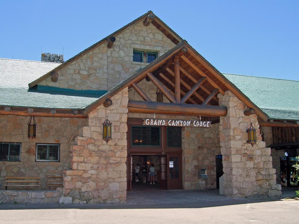 An undated photo of the front entrance of the Grand Canyon Lodge, featuring its sloped roof, huge ponderosa beams and massive limestone façade.