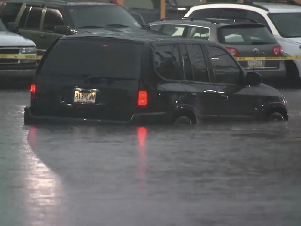 This image made from video shows cars submerged in floodwaters in Rahway, NJ., on July 14.