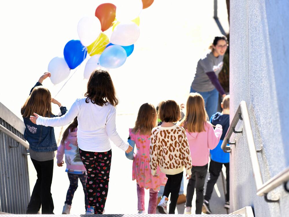 A teacher gives a tour of Nora Sterry Elementary School to students in Los Angeles in January. California is one of 24 states suing the Trump administration over frozen education grant funding.