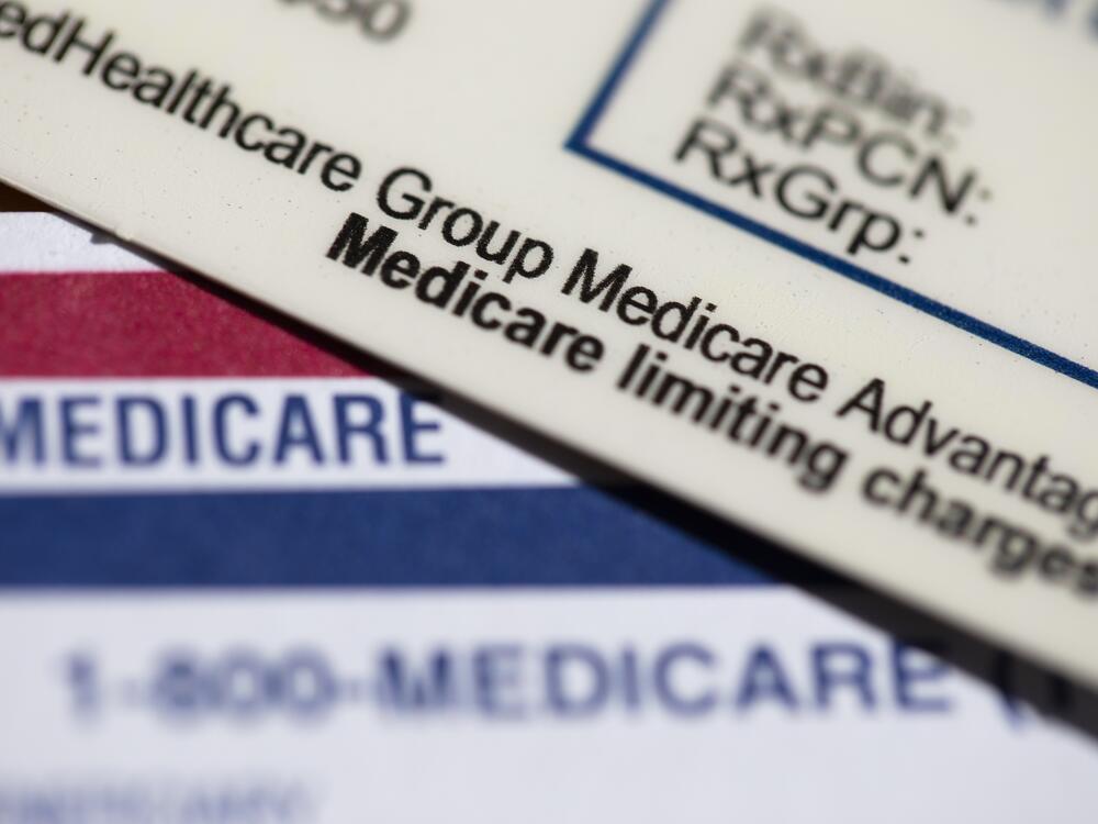Medical plan cards are seen in Portland, Ore. A federal judge this past week overturned a Consumer Financial Protection Bureau rule that would have removed medical bills from credit reports and prevented lenders from making decisions based on that medical information.