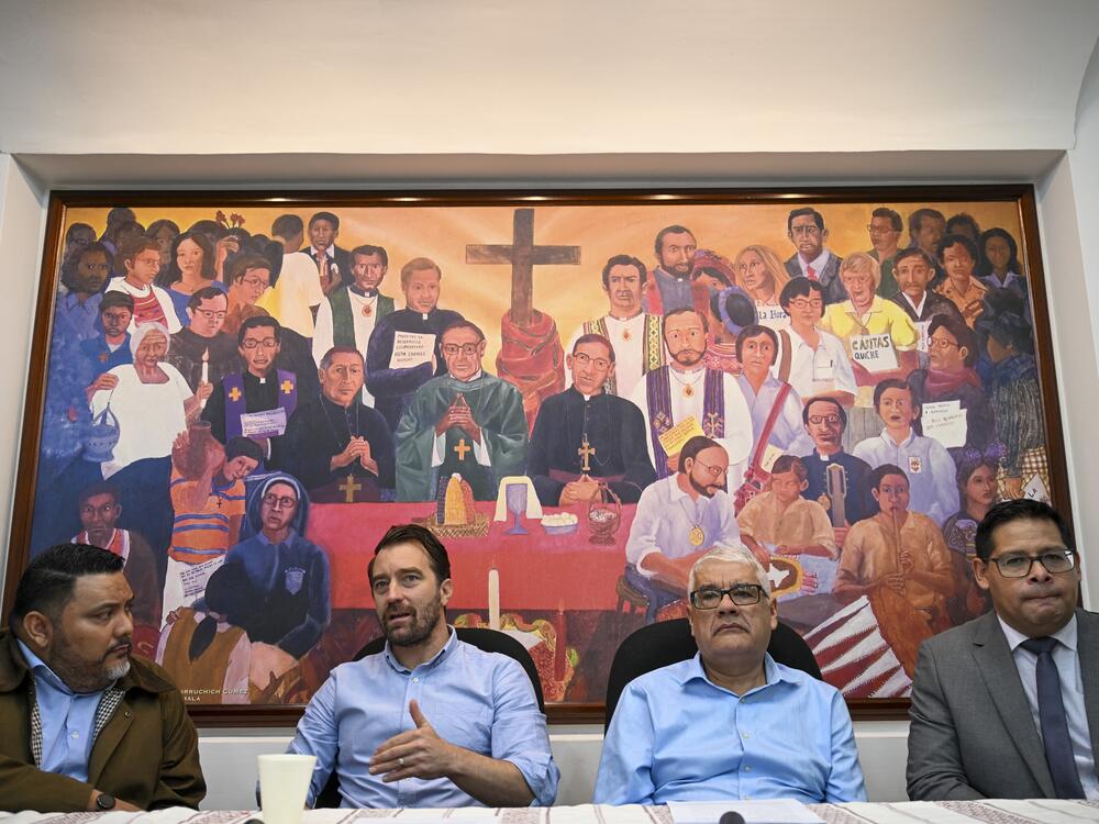 Executive director of the NGO Cristosal, Noah Bullock (C) speaks next to director of research Rene Valiente (L), Abraham Abrego (2nd R), director of the strategic litigation and Guatemalan lawyer Rafael Cruz (R) during a press conference in Guatemala City on July 17, 2025.