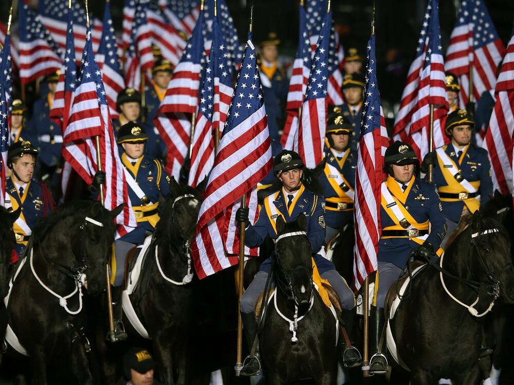 Mounted members of the military ride horses as the presidential inaugural parade winds through the nation's capital January 21, 2013 in Washington, DC. Barack Obama was re-elected for a second term as President of the United States.