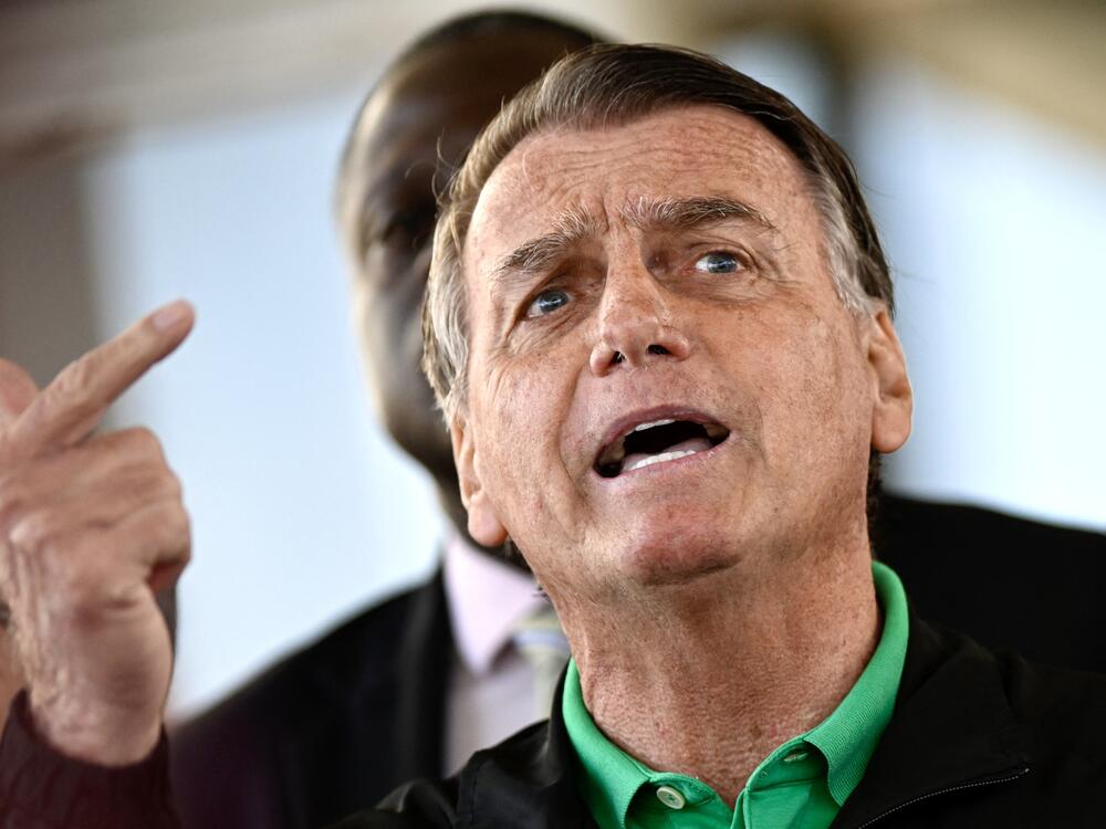 Former Brazilian President Jair Bolsonaro speaks to the press at the Federal Senate in Brasilia on July 17, 2025.