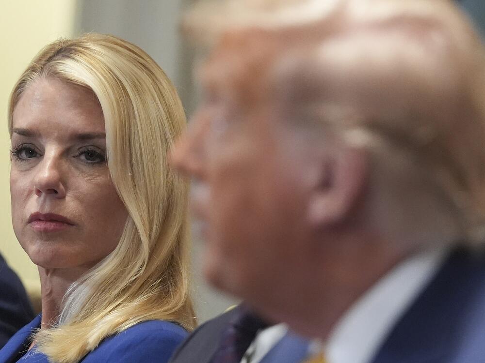 Attorney General Pam Bondi, left, listens as President Donald Trump, right, speaks during a cabinet meeting at the White House.
