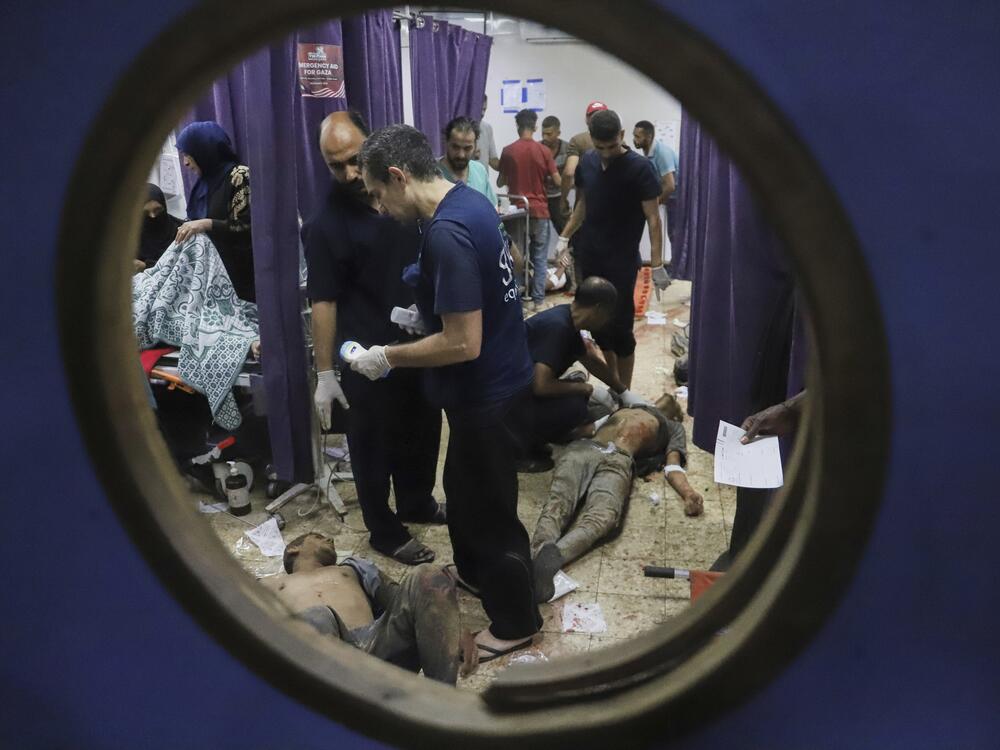 Palestinians who were injured during a food distribution at a center run by the Gaza Humanitarian Foundation, a U.S.-backed organization approved by Israel, receive treatment on the floor of Nasser Hospital in Khan Younis, southern Gaza Strip, Saturday, July 19, 2025.