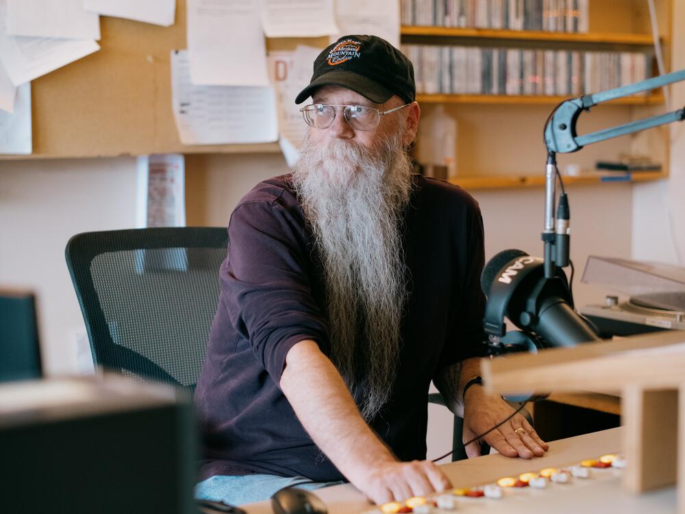 Scott Smith, Allegheny Mountain Radio's general manager, sits in the main broadcasting studio at station WVLS in Monterey, Va. Smith says Congress' decision last week to slash public media funding could wipe out up to 65 percent of his budget.
