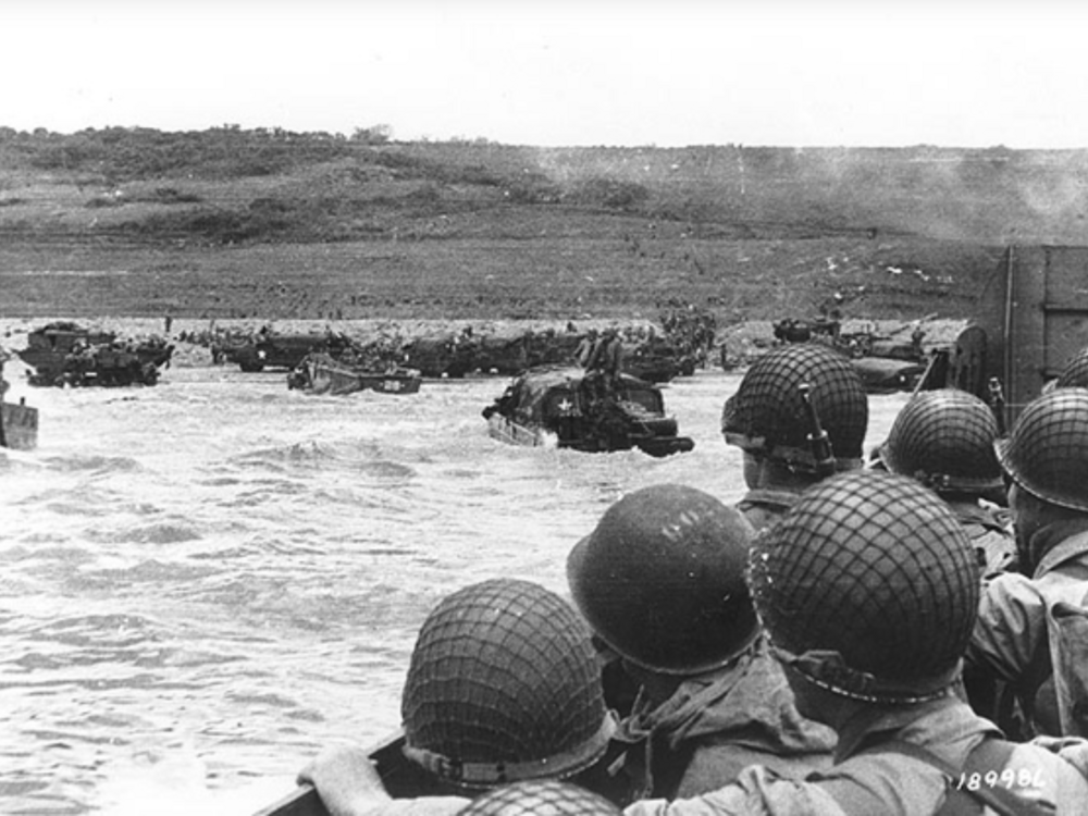 Soldiers crowd a landing craft on their way to Omaha Beach during the Allied Invasion of Europe, 