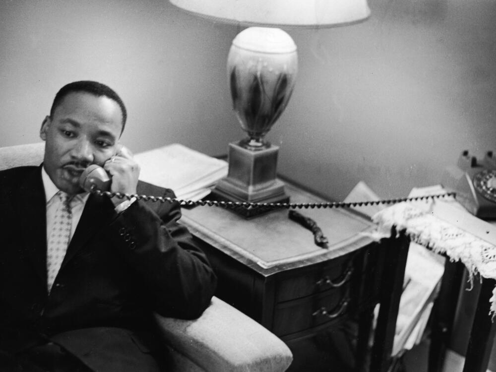 Dr. Martin Luther King, Jr. sits speaks on the telephone after encountering a white mob protesting against the Freedom Riders in Montgomery, Alabama, May 26, 1961. On Monday, the Trump administration released a trove of records about King's assassination.