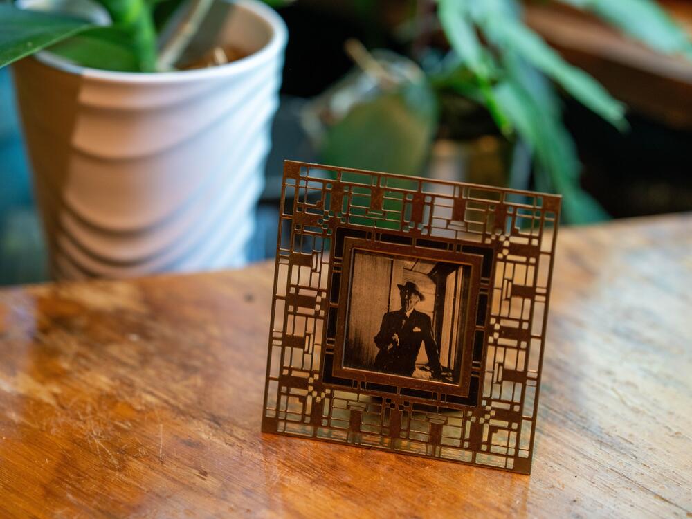 A framed photo of architect Frank Lloyd Wright.