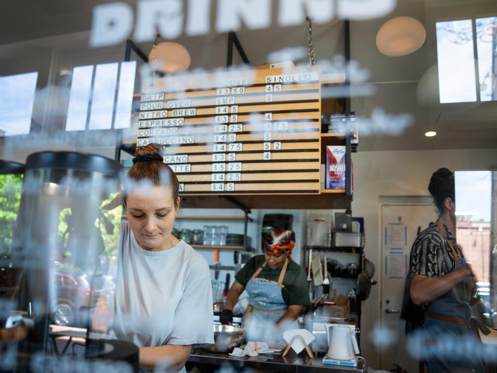 Kristen Tizaawie-Vogel (left) prepares a drink at a Lost Sock Roasters coffee shop in Washington, D.C.