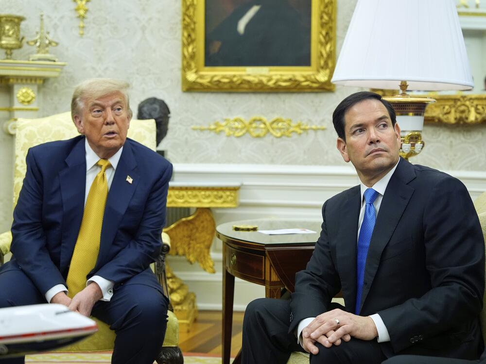 President Trump and Secretary of State Marco Rubio listen during an Oval Office meeting at the White House on July 16.