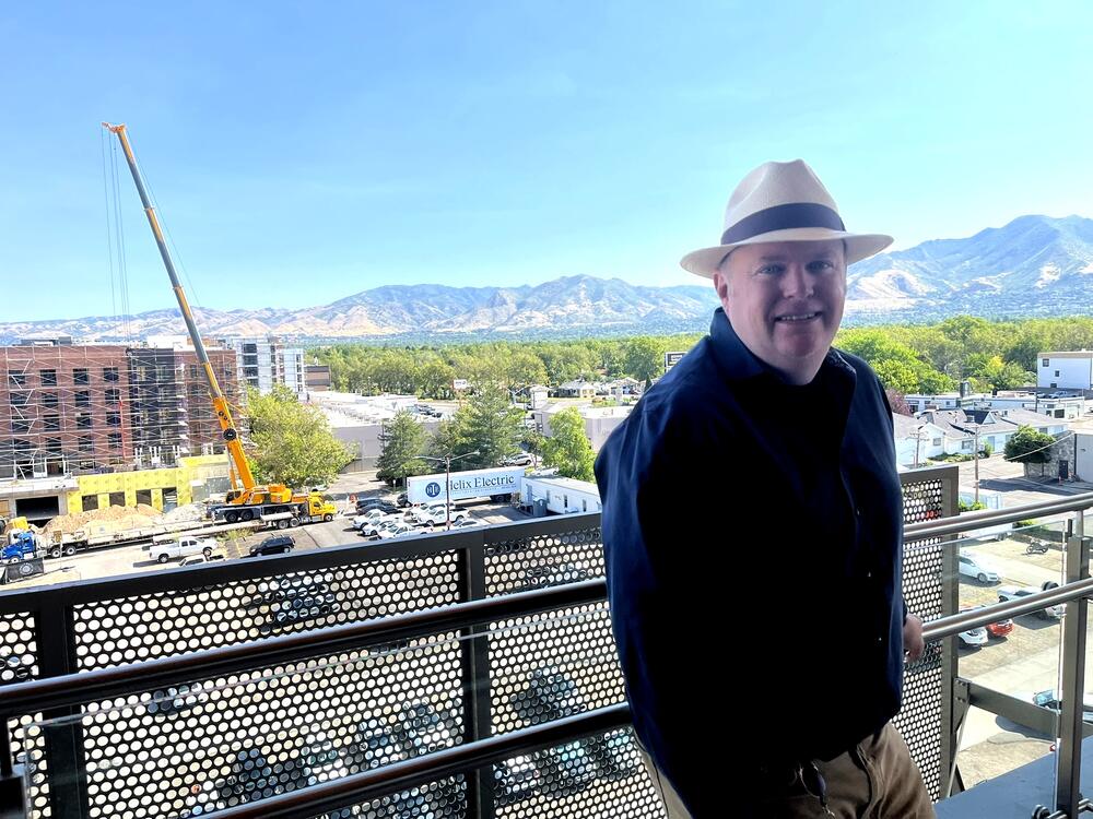 Francis Xavier Lilly, the planning director and assistant city manager for Millcreek, stands on the sixth-floor balcony of City Hall.