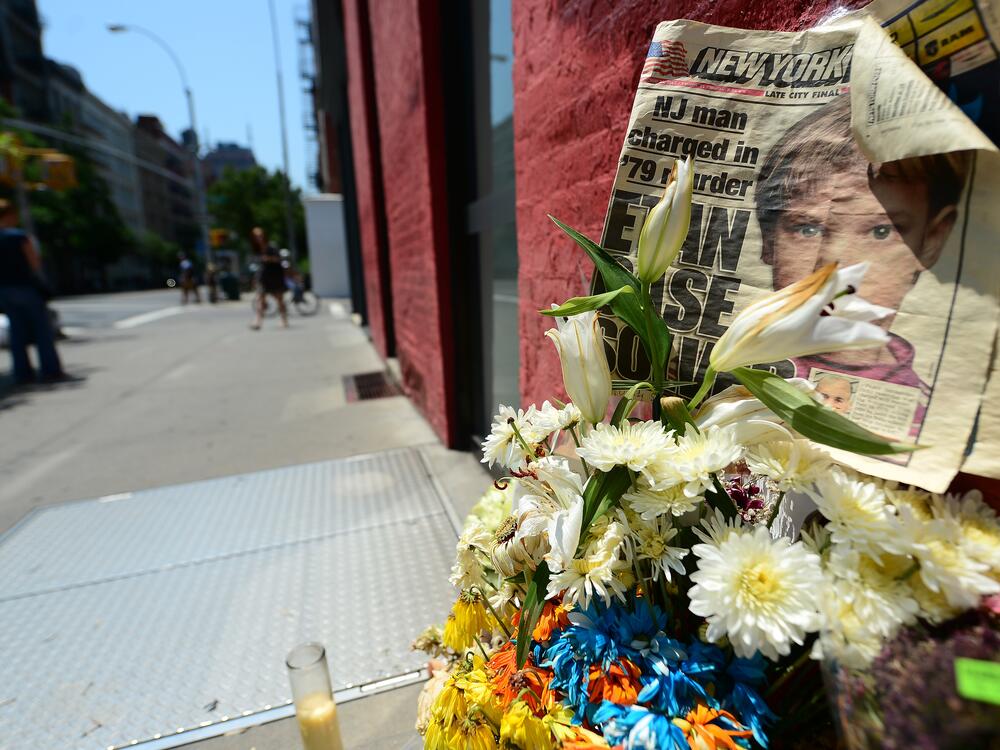 People walk past a street shrine to Etan Patz in 2012.