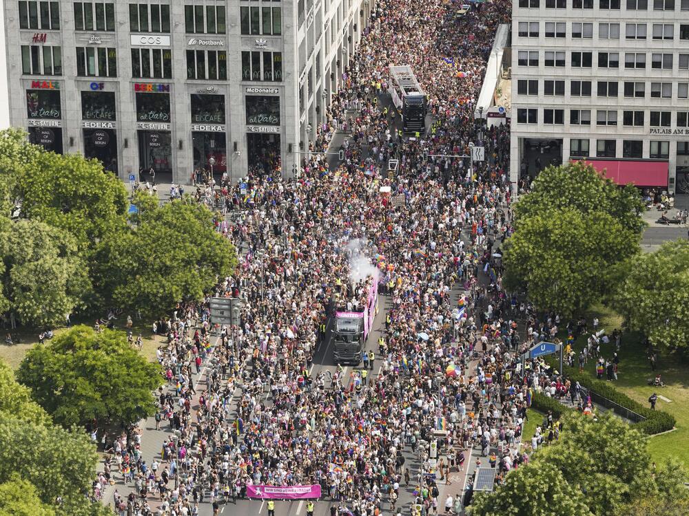 Revelers march down the Leipziger Strasse street during a Pride parade in Berlin, July 23, 2022.