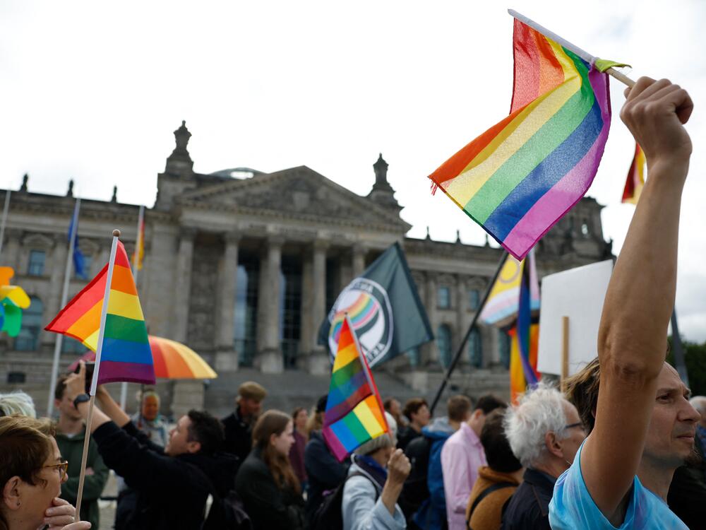 Demonstrators participate in an event called 