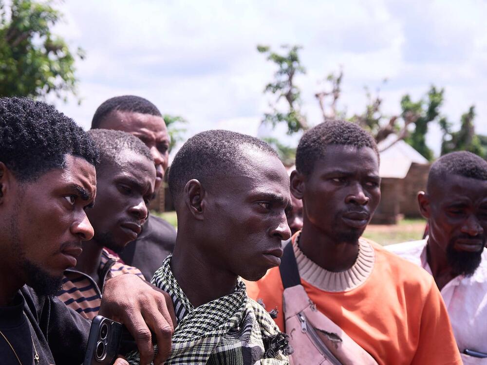 Survivors and village residents in Yelwata Village, central Nigeria after the attacks in mid-June.