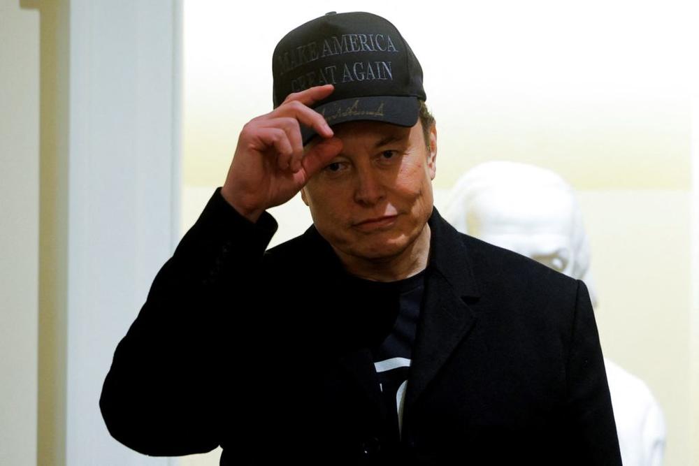 Elon Musk attends the first cabinet meeting hosted by U.S. President Donald Trump, in Washington, D.C., U.S., February 26, 2025. REUTERS/Brian Snyder