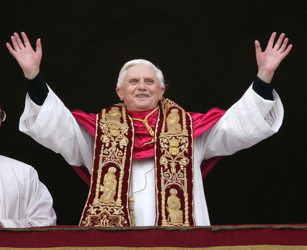 FILE PHOTO: Pope Benedict XVI, Cardinal Joseph Ratzinger of Germany, waves from a balcony of St. Peter's Basilica. Pope Benedict XVI, Cardinal Joseph Ratzinger of Germany, waves from a balcony of St. Peter's Basilica in the Vatican after being elected by the conclave of cardinals, April 19, 2005. REUTERS/Max Rossi/File Photo