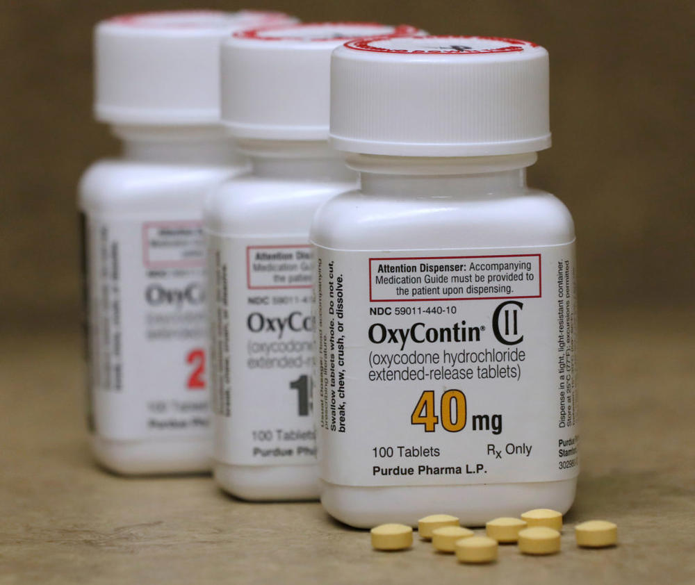 Bottles of prescription painkiller OxyContin pills, made by Purdue Pharma LP sit on a counter at a local pharmacy in Provo, Utah, U.S., April 25, 2017. Photo by: George Frey/File Photo/Reuters