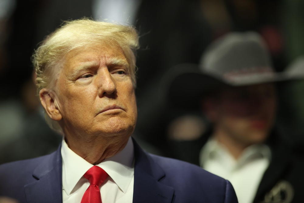 Former United States President Donald Trump stands on the floor during the Division I Mens Wrestling Championship in Tulsa, Oklahoma. Photo by Shane Bevel/ NCAA Photos via Getty Images