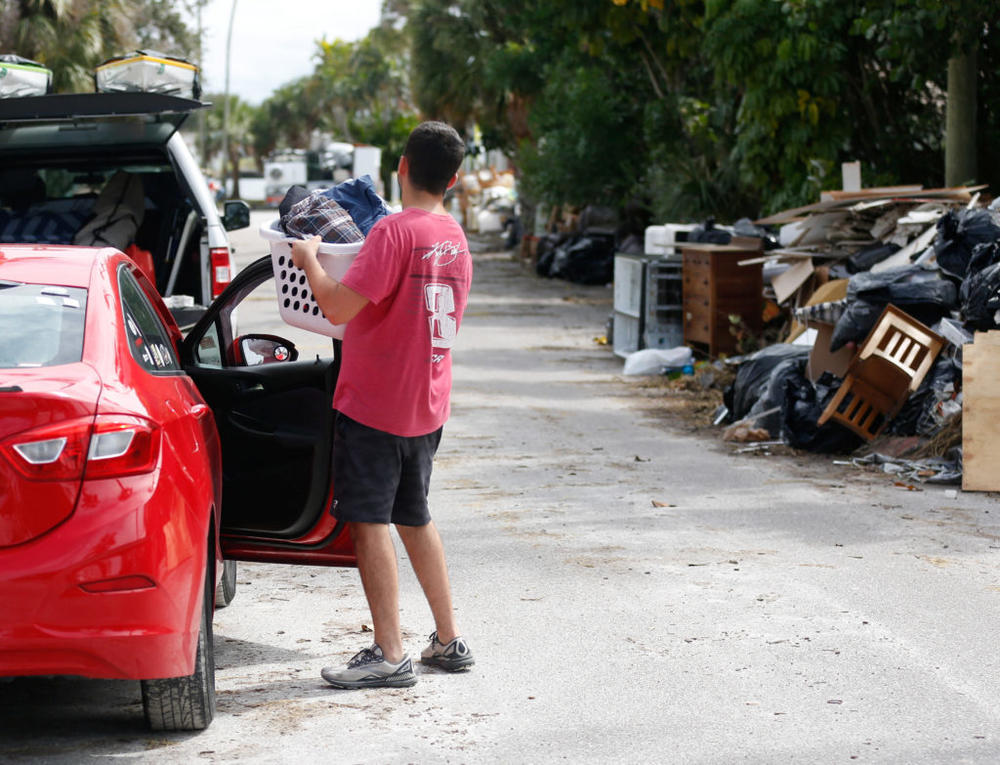 Sam Grande carries his belongings as he prepares to evacuate his home before the arrival of Hurricane Milton, St. Pete Beach, Florida, on Oct. 7, 2024. Photo by Octavio Jones/ Reuters