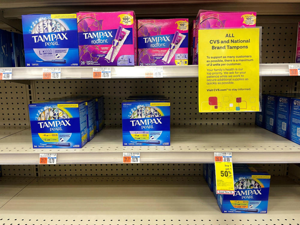 A sign notifies customers that there is a limit of two units per customer buying "all CVS and national brand tampons" at a CVS drug store in Somerville, Massachusetts, U.S., June 29, 2022. REUTERS/Brian Snyder