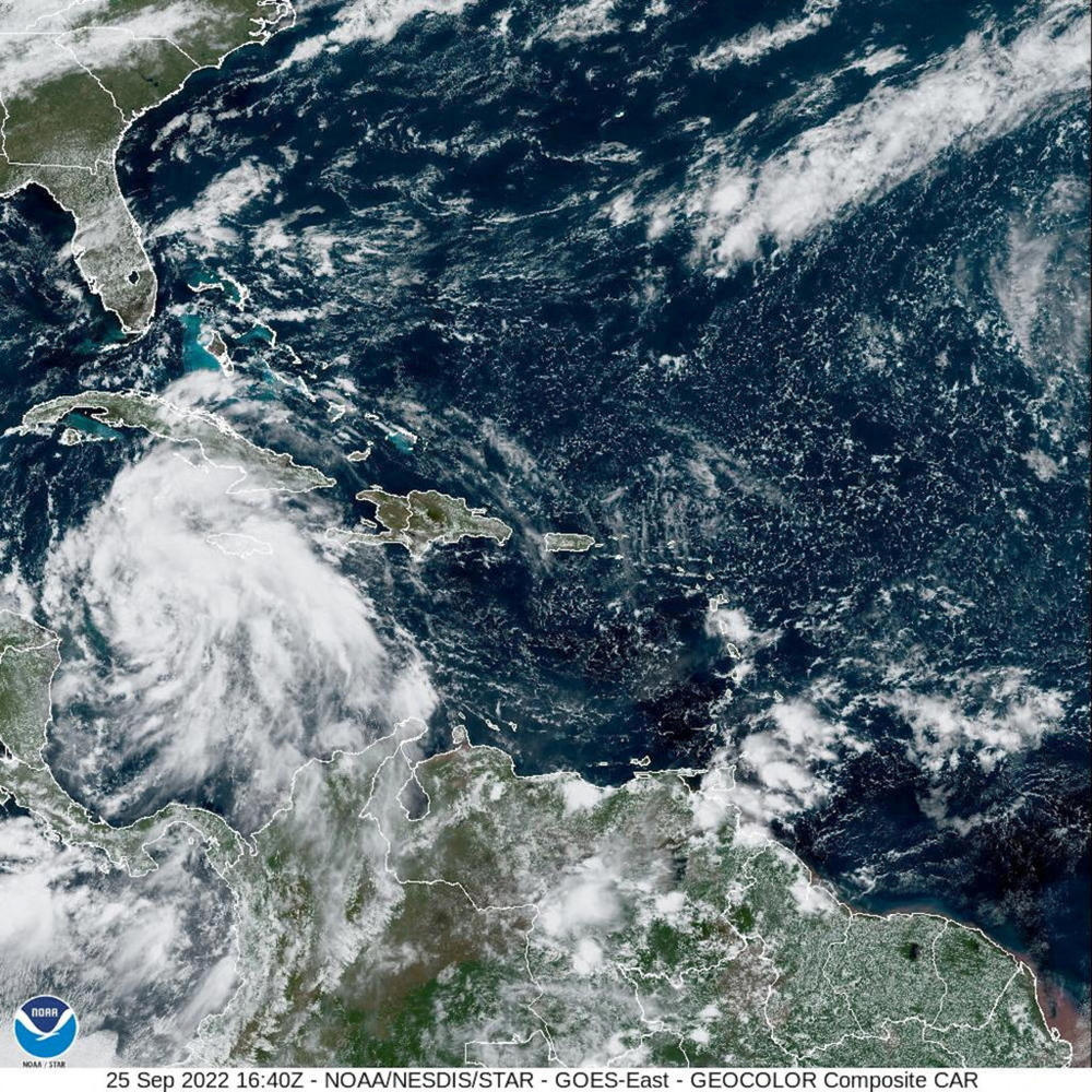 FILE PHOTO: Tropical Storm Ian is seen near the coast of Cuba in this satellite image taken September 25, 2022. National Oceanic and Atmospheric Administration (NOAA)/Handout via REUTERS THIS IMAGE HAS BEEN SUPPLIED BY A THIRD PARTY/File Photo