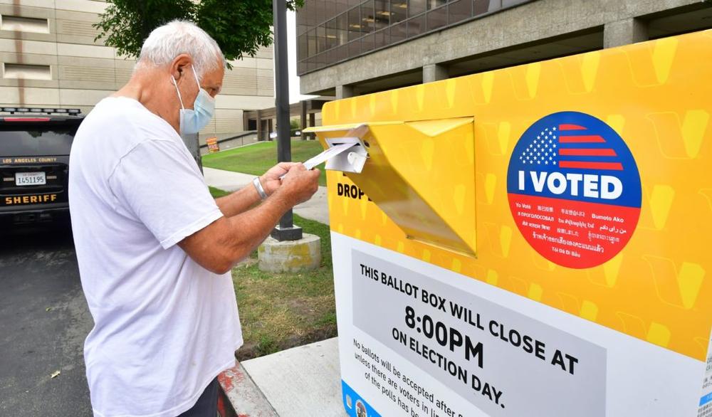 A voter drops his ballot for the 2020 US elections into an official ballot drop box at the Los Angeles County Registrar in Norwalk, California on October 19, 2020. - Voter turnout is ten times higher than in 2016 in California according the Secretary of State Alex Padilla as over 600,000 Los Angeles County ballots are already at the county registrar. (Photo by Frederic J. BROWN / AFP) (Photo by FREDERIC J. BROWN/AFP via Getty Images)