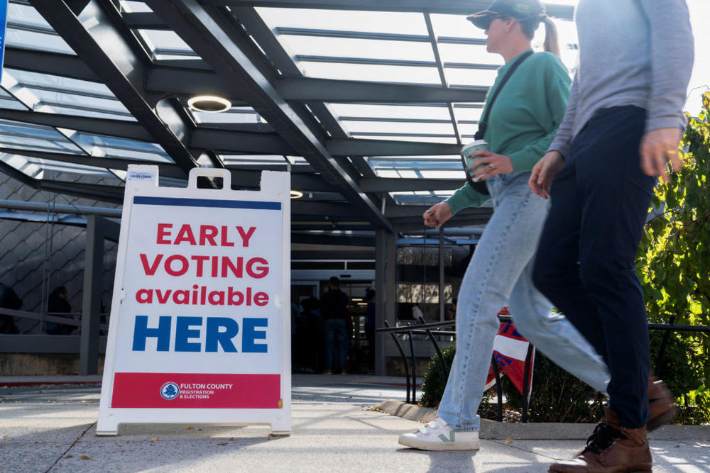 Voters attend to cast their ballots in the runoff election for the Senate position, between Democratic incumbent Raphael Warnock and Republican candidate Herschel Walker, at the Metropolitan Library, in Atlanta, Georgia, U.S., November 29, 2022. REUTERS/Megan Varner