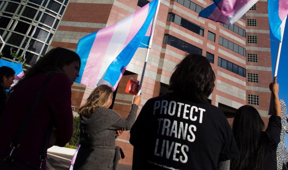 Members of the transgender and gender non-binary community and their allies gather to celebrate International Transgender Day of Visibility, March 31, 2017 at the Edward R. Roybal Federal Building in Los Angeles, California. International Transgender Day of Visibility is dedicated to celebrating transgender people and raising awareness of discrimination faced by transgender people worldwide. / AFP PHOTO / Robyn Beck (Photo credit should read ROBYN BECK/AFP via Getty Images)