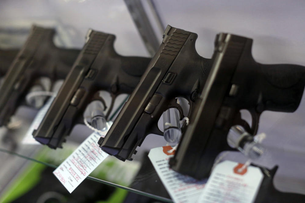 Handguns are seen for sale in a display case at Metro Shooting Supplies in Bridgeton, Missouri, November 13, 2014. The store has reported an increase in gun sales as the area waits for a grand jury to reach a decision this month on whether to indict Darren Wilson, the white police officer who shot and killed the 18-year-old Mike Brown, who was black, on Aug. 9 in the St. Louis suburb of Ferguson. REUTERS/Jim Young (UNITED STATES - Tags: CRIME LAW CIVIL UNREST POLITICS)