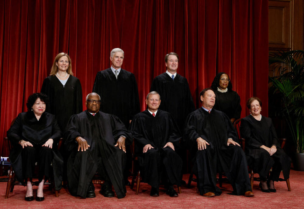 FILE PHOTO: U.S. Supreme Court justices pose for their group portrait at the Supreme Court in Washington, U.S., October 7, 2022. Seated (L-R): Justices Sonia Sotomayor, Clarence Thomas, Chief Justice John G. Roberts, Jr., Samuel A. Alito, Jr. and Elena Kagan. Standing (L-R): Justices Amy Coney Barrett, Neil M. Gorsuch, Brett M. Kavanaugh and Ketanji Brown Jackson. REUTERS/Evelyn Hockstein/File Photo