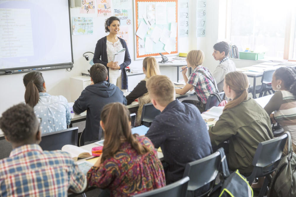 A teacher in front of a group of students