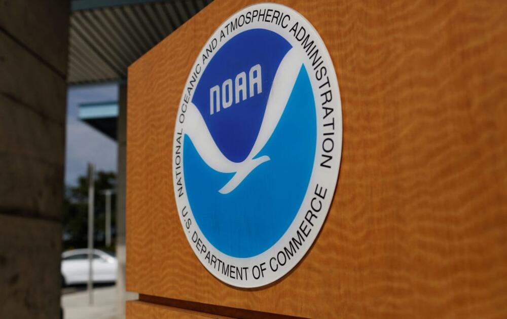 The logo of the National Oceanic and Atmospheric Administration is seen at the National Hurricane Center in Miami, Florida, U.S. August 29, 2019. REUTERS/Marco Bello