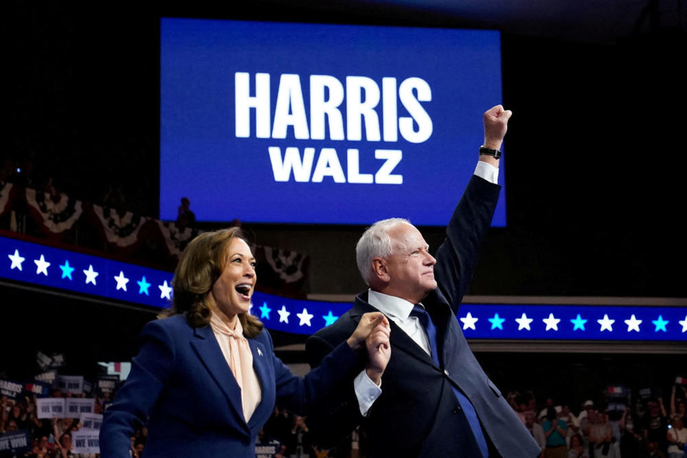 U.S. Vice President and Democratic presidential candidate Kamala Harris and her newly chosen vice presidential running mate Minnesota Governor Tim Walz react as they hold a campaign rally in Philadelphia, Pennsylvania, U.S., August 6, 2024. Photo by Elizabeth Frantz/REUTERS