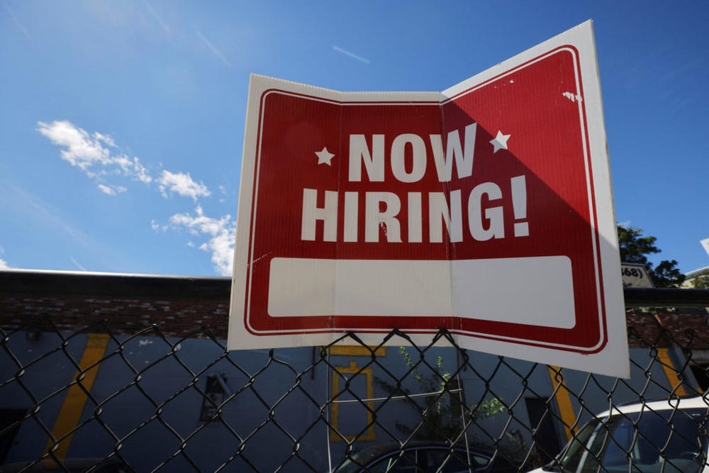 A "now hiring" sign is displayed outside Taylor Party and Equipment Rentals in Somerville, Massachusetts, U.S., September 1, 2022. REUTERS/Brian Snyder