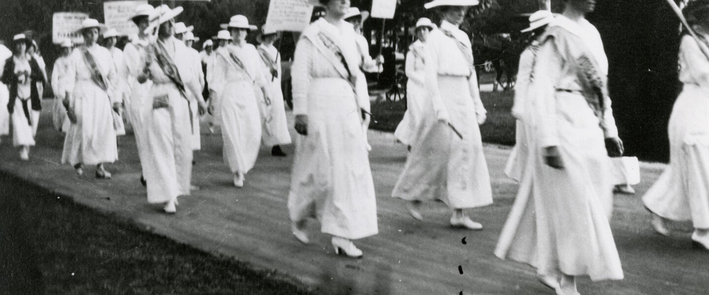 Mrs. Anne Dallas Dudley leads a march.