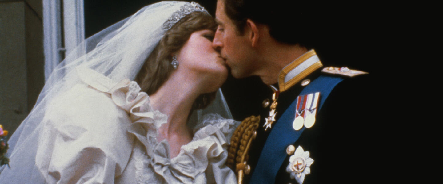 Princess Diana and Prince Charles kiss after their wedding.