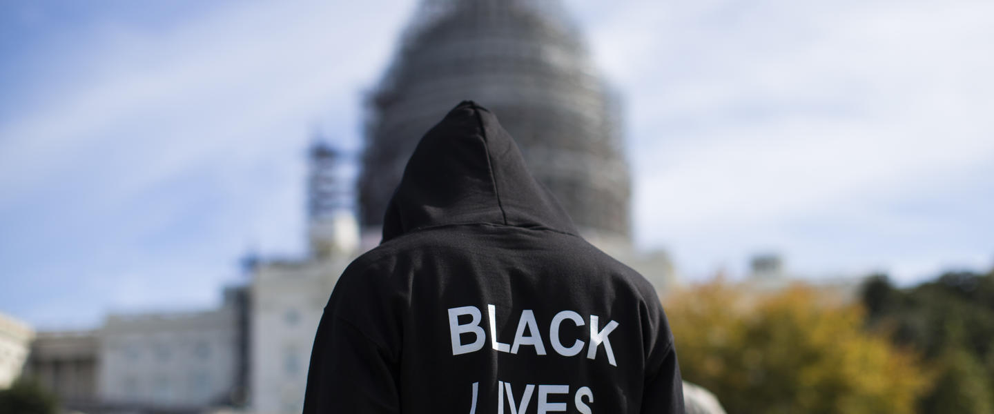 Neal Blair, of Augusta, Ga., wears a hoodie which reads, "Black Lives Matter" as stands on the lawn of the Capitol building during a rally to mark the 20th anniversary of the Million Man March, on Capitol Hill, on Saturday, Oct. 10, 2015, in Washington.