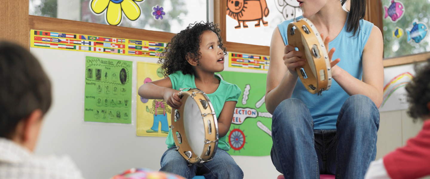 Music teacher with student