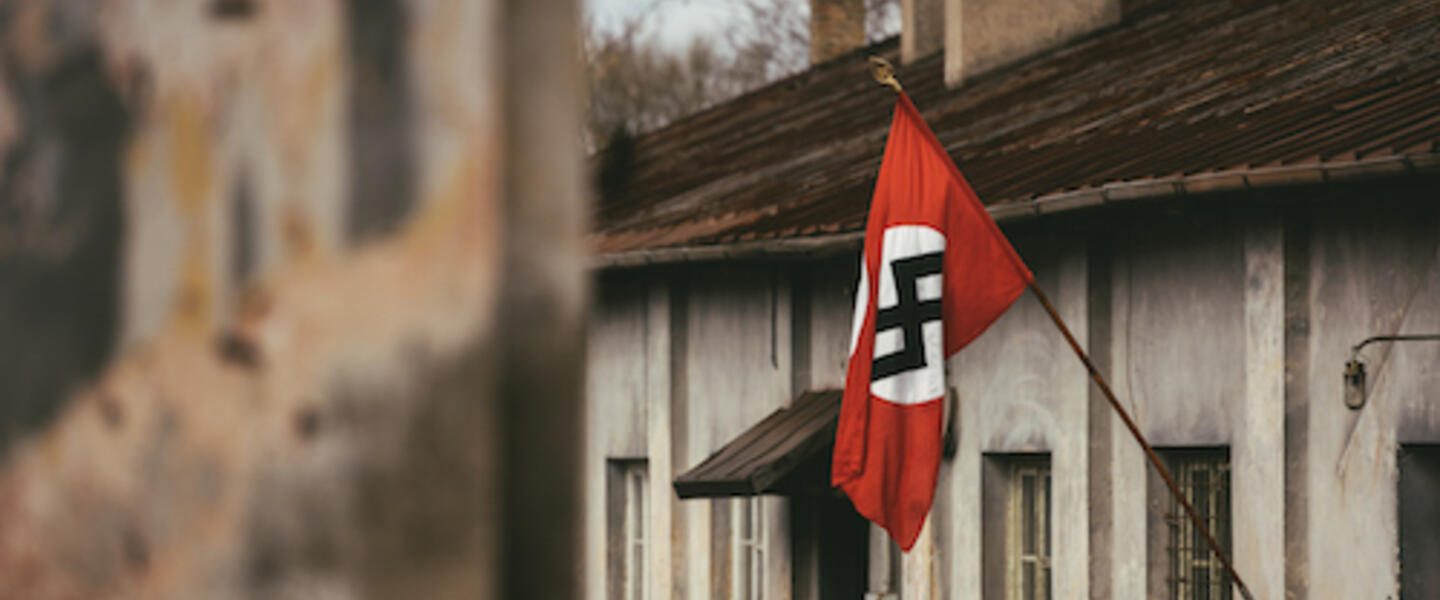 Drama Reconstruction Swastika Nazi flag in Dachau Concentration Camp
