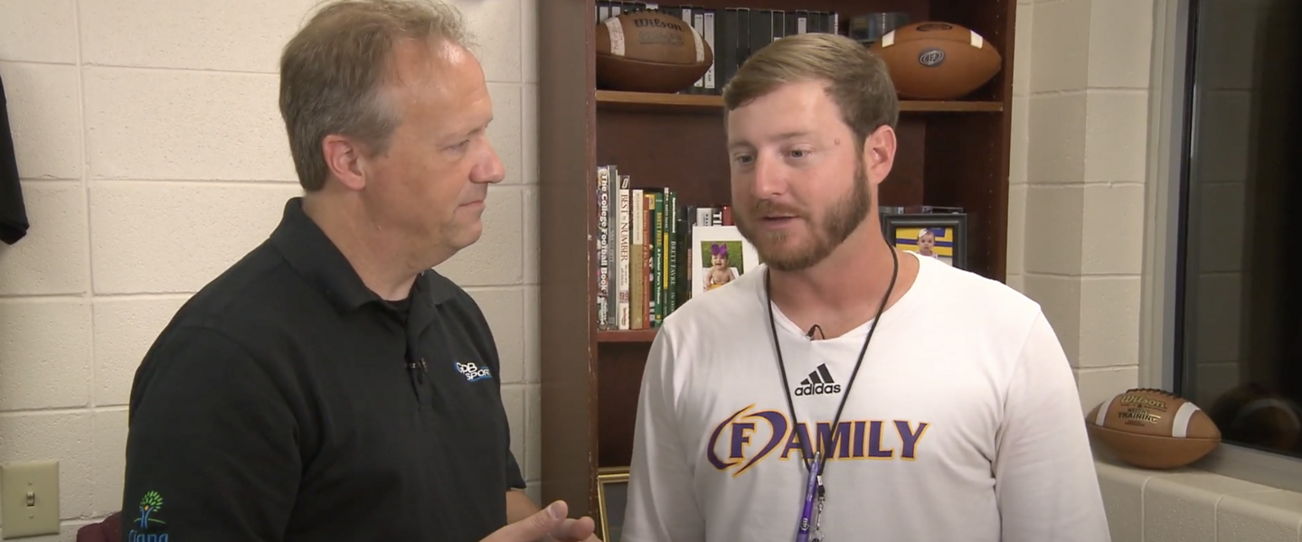 GPB's Jon Nelson (left) talks with Tucker Pruitt (right), the head football coach at Fitzgerald High School.