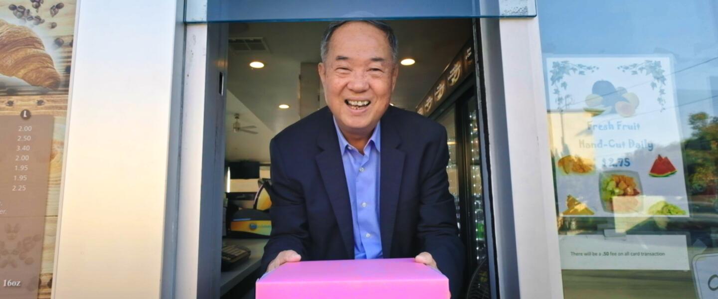 Ted Ngoy, The Donut King, at Donut shop.