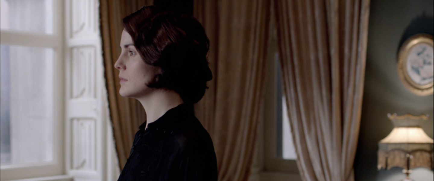 Mary looks out of a window.