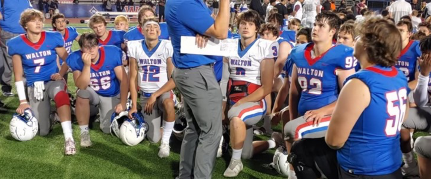 Walton Head Football Coach Daniel Brunner and team