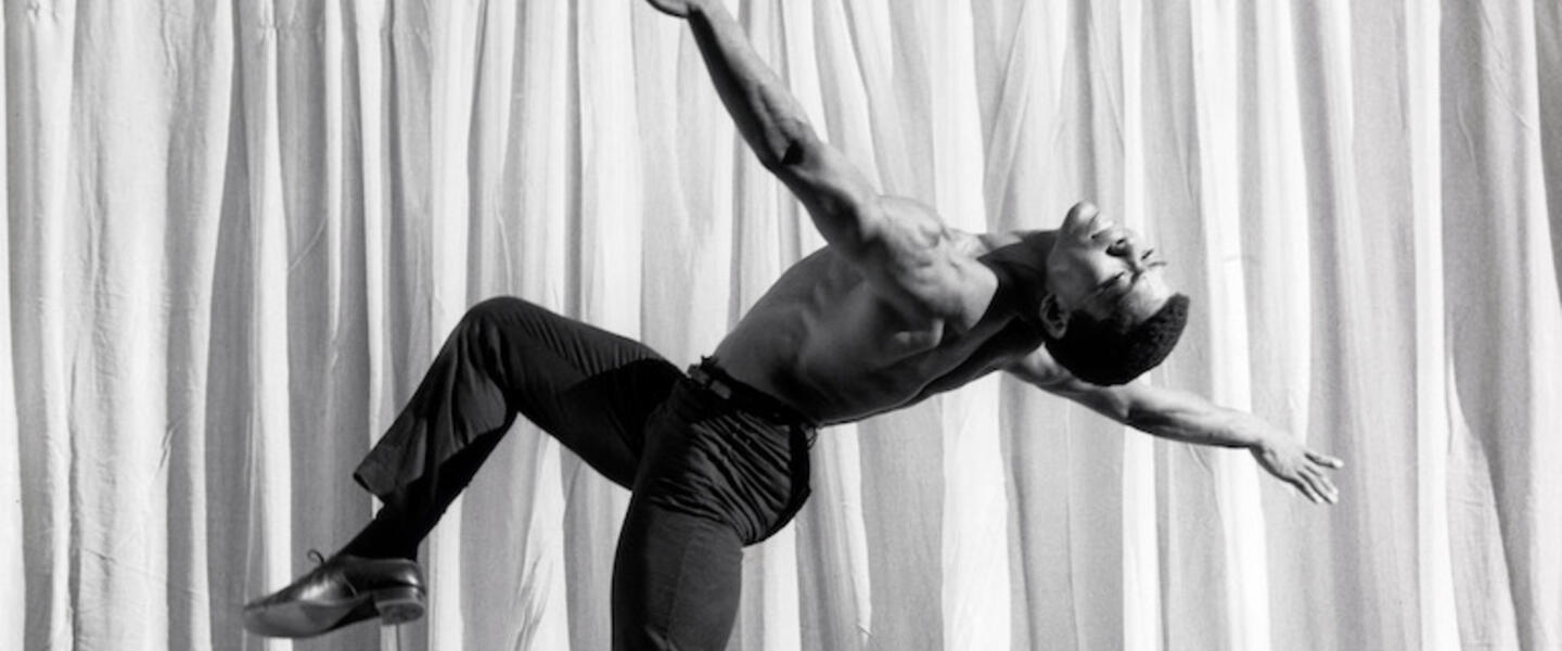 Alvin Ailey dancing gracefully.