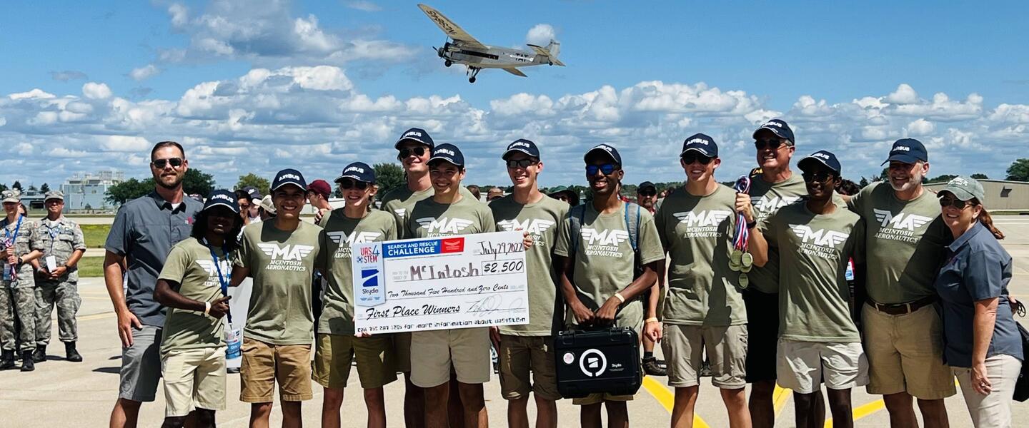 McIntosh Aeronautics hold up their first place prize.
