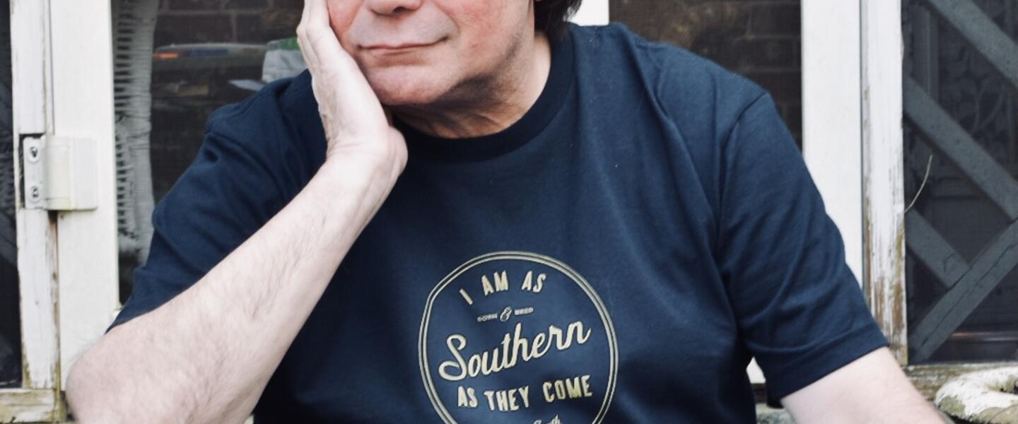 Chuck Reece in a blue t-shirt